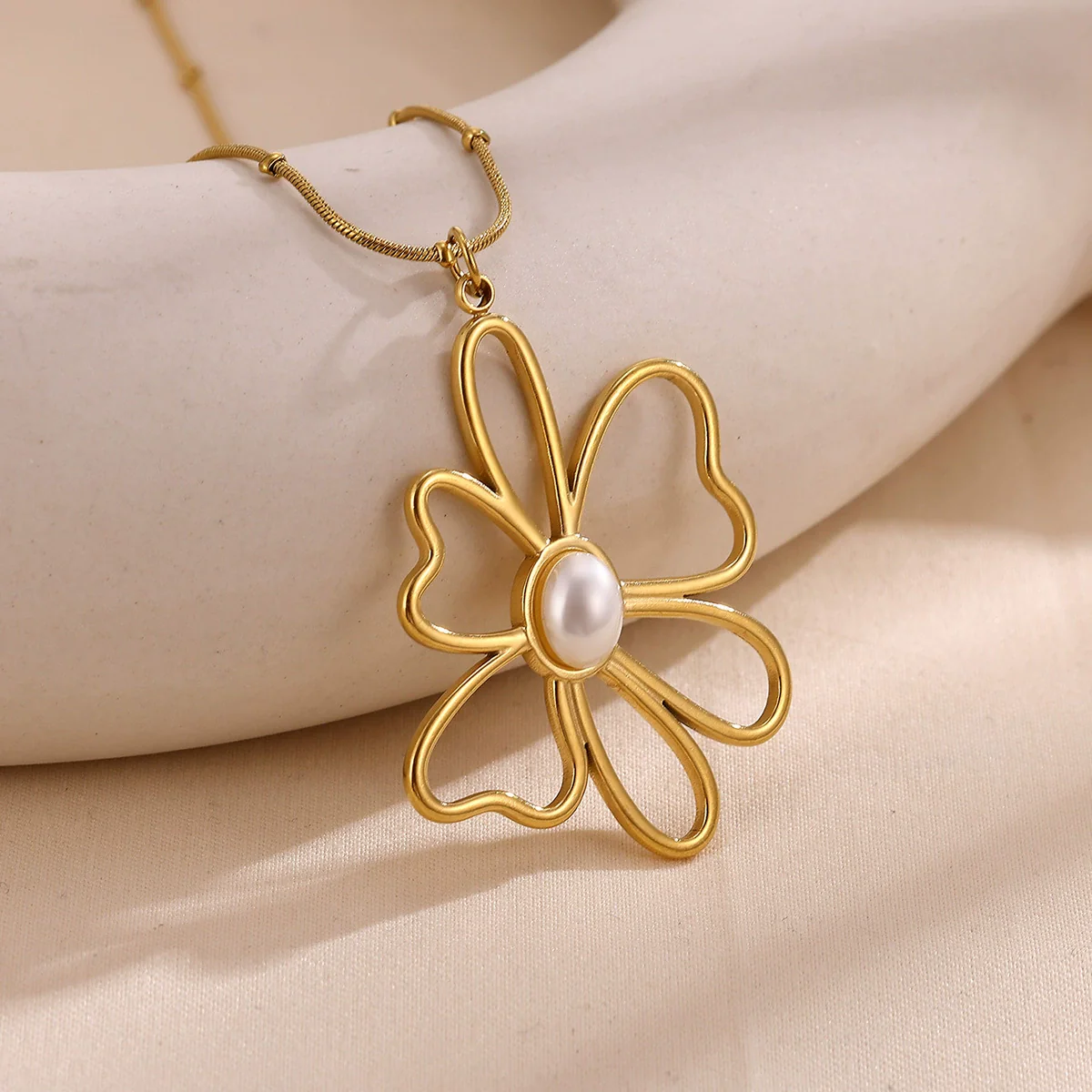 Wholesale Gold Electroplated Stainless Steel Hollow Flower Pendant Necklace With Cross Chain For Unisex