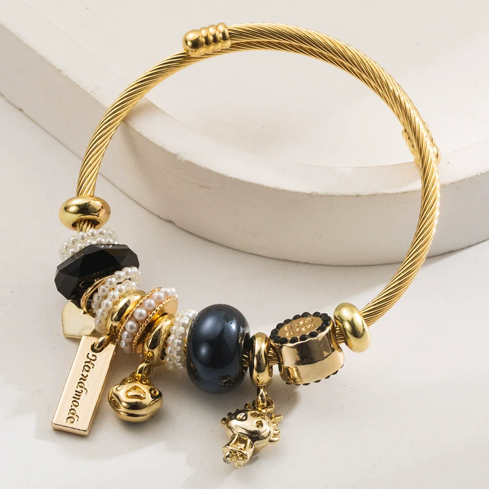 Wholesale Golden Stainless Steel Alloy Women's Bracelet With Diamond Treatment And Small Animal Pendant - Image 4
