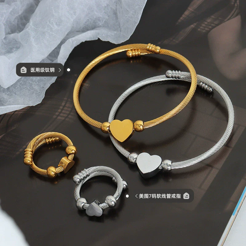 Wholesale Titanium Steel Goldplated Love Shape Jewelry Set Including Adjustable Coil Bracelet And Trendy Ring - Image 2