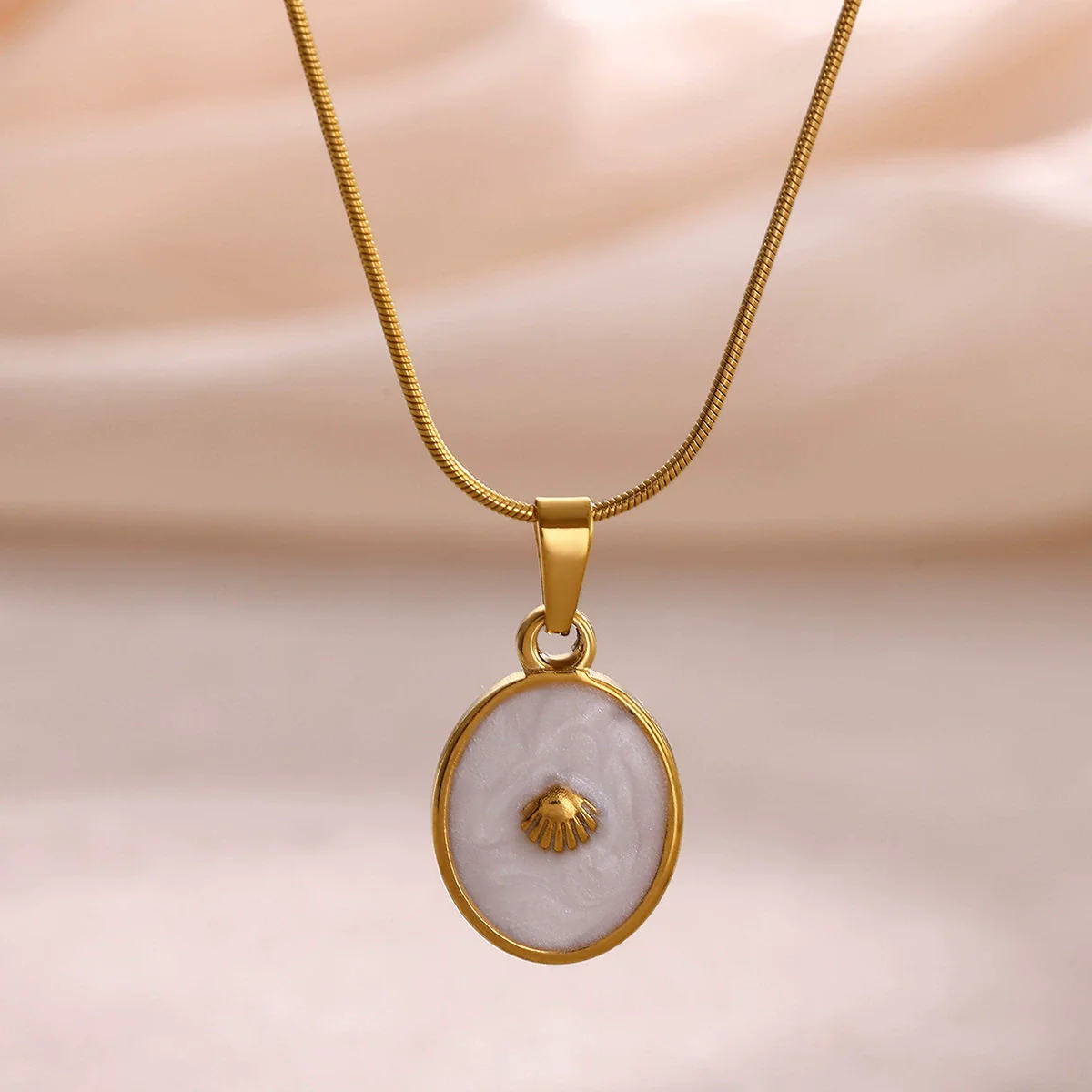 Wholesale Unisex Gold Electroplated Stainless Steel Scallop Inlaid Oval Cross Chain Necklace With White Enamel
