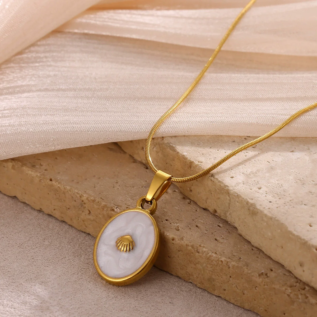 Wholesale Unisex Gold Electroplated Stainless Steel Scallop Inlaid Oval Cross Chain Necklace With White Enamel - Image 3