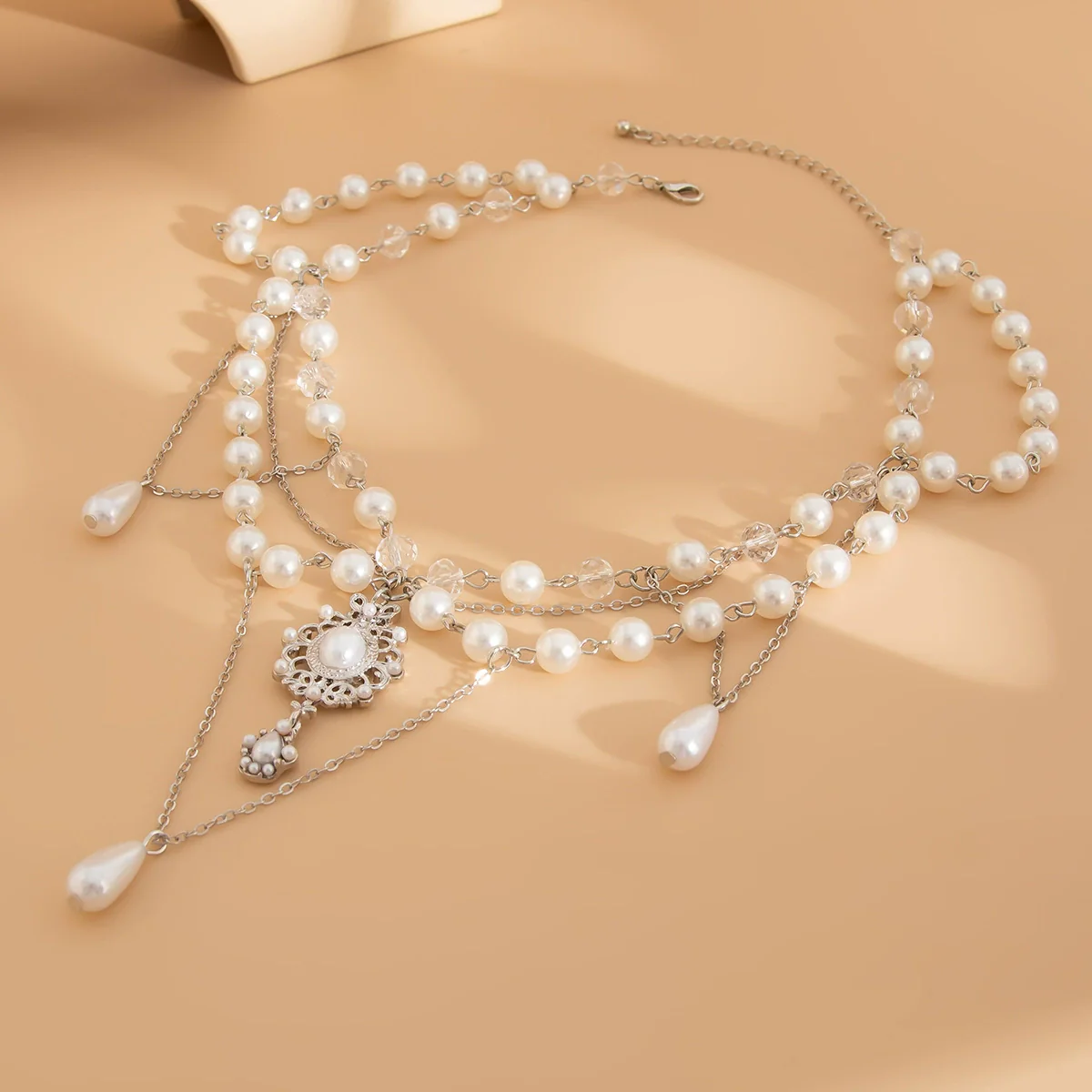 Wholesale Women's Imitation Pearl Tassel Necklace With Alloy Pendant Drop Shape Electroplated Metal Hollow Design - Image 4