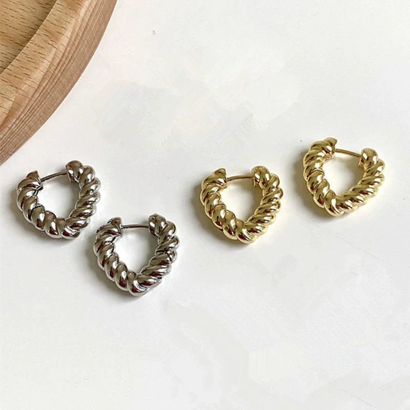 Wholesale Women's Light Luxury Alloy Heart Twist Love Earrings With Gold Plating Electroplating