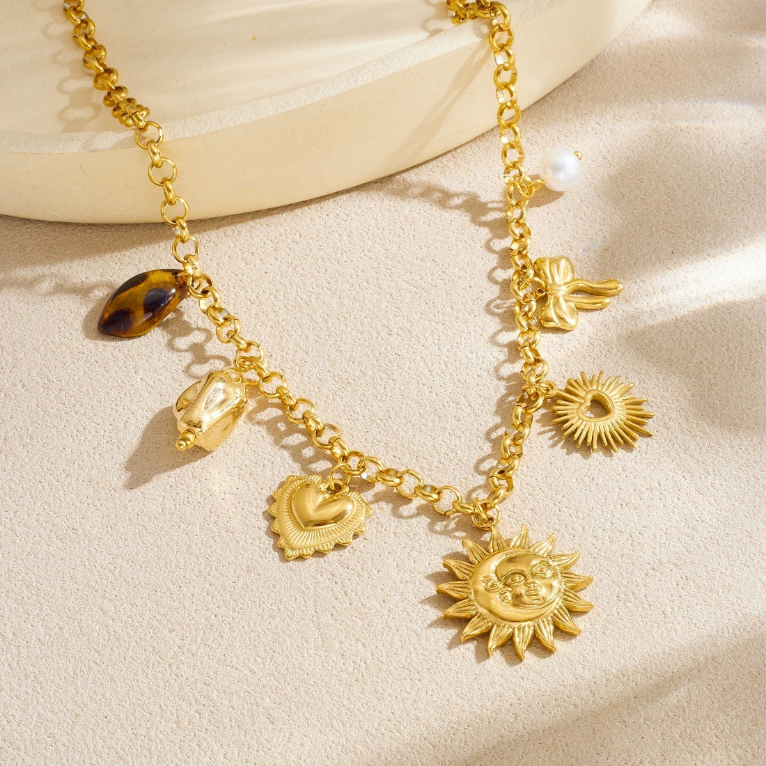 Wholesale Women's Medieval Style Goldplated Stainless Steel Sun Face Heartshaped Bow Tie Pendant Necklace With O Word Chain - Image 2