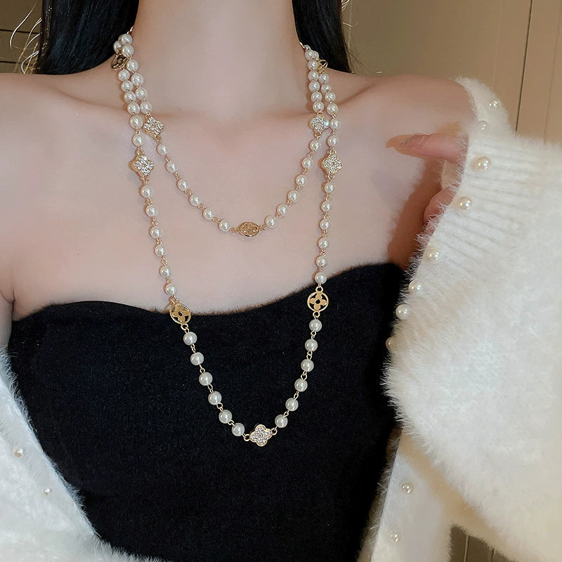 Wholesale Women's Metal And Imitation Pearl Sweater Chain Necklace With Flower Pattern And Light Luxury Style Set With Pearls - Image 11