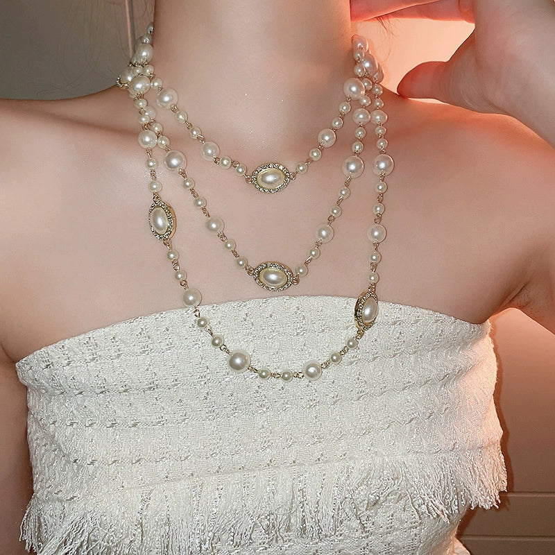 Wholesale Women's Metal And Imitation Pearl Sweater Chain Necklace With Flower Pattern And Light Luxury Style Set With Pearls - Image 13