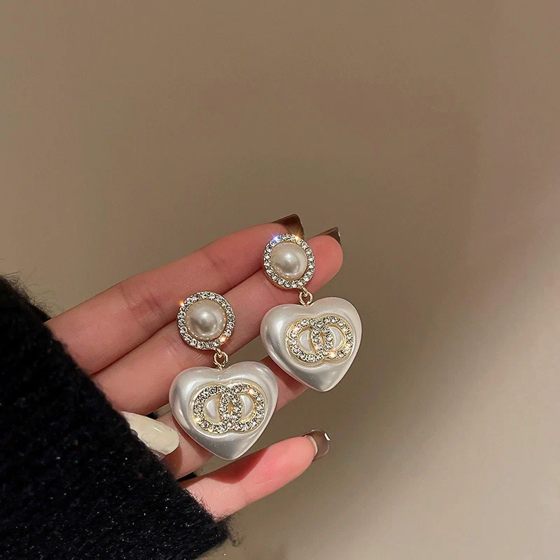 Wholesale Women's Metal Electroplated Bow Shape Pearl Tassel Earrings Light Luxury Style - Image 13