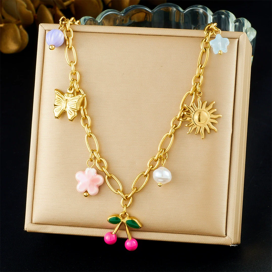 Wholesale Women's Retro Goldplated Stainless Steel Fruitshaped Sun Butterfly Pendant Necklace With O Word Chain