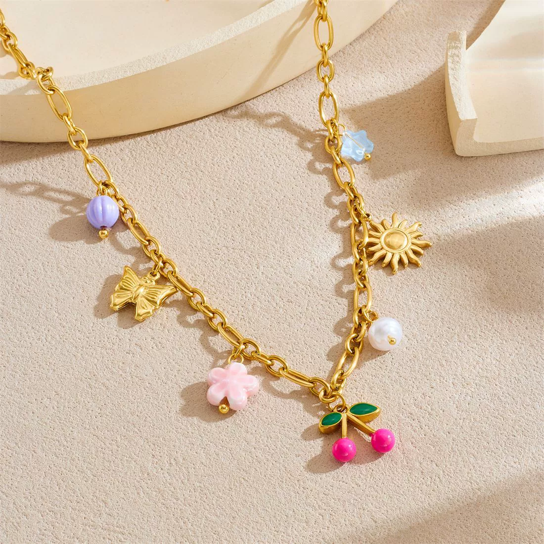 Wholesale Women's Retro Goldplated Stainless Steel Fruitshaped Sun Butterfly Pendant Necklace With O Word Chain - Image 2
