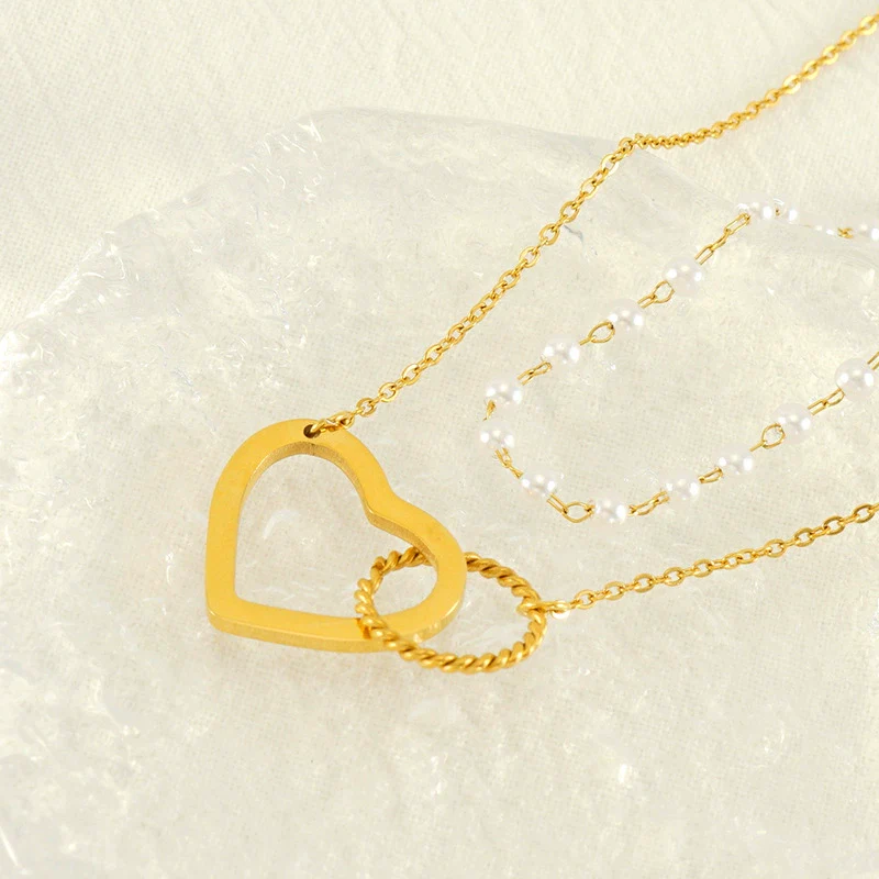 Wholesale Women's 316L Stainless Steel Double Pearl Necklace With Heart And Geometric Pattern Hollow Pendant And Electroplating Treatment - Image 3