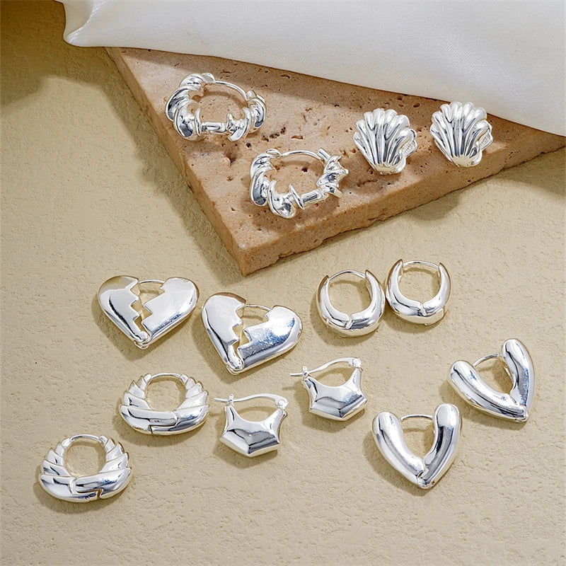Wholesale Women's Stainless Steel Geometric Ushaped Hollow Exaggerated Simple Silver Glossy Electroplated Earrings