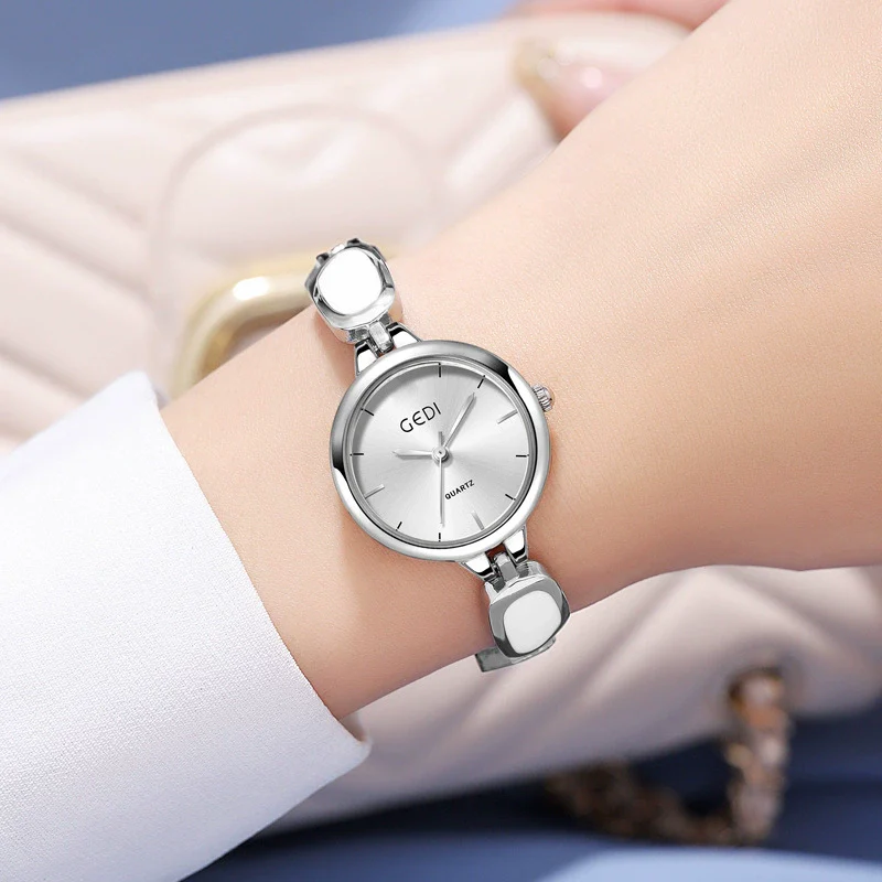 Women's Alloy Band And Case Fashion Light Luxury Disc Elegant Quartz Watch With Sun Pattern And Spiral Crown